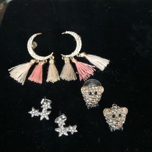 Adorable trio of crystal and gold tone earrings.